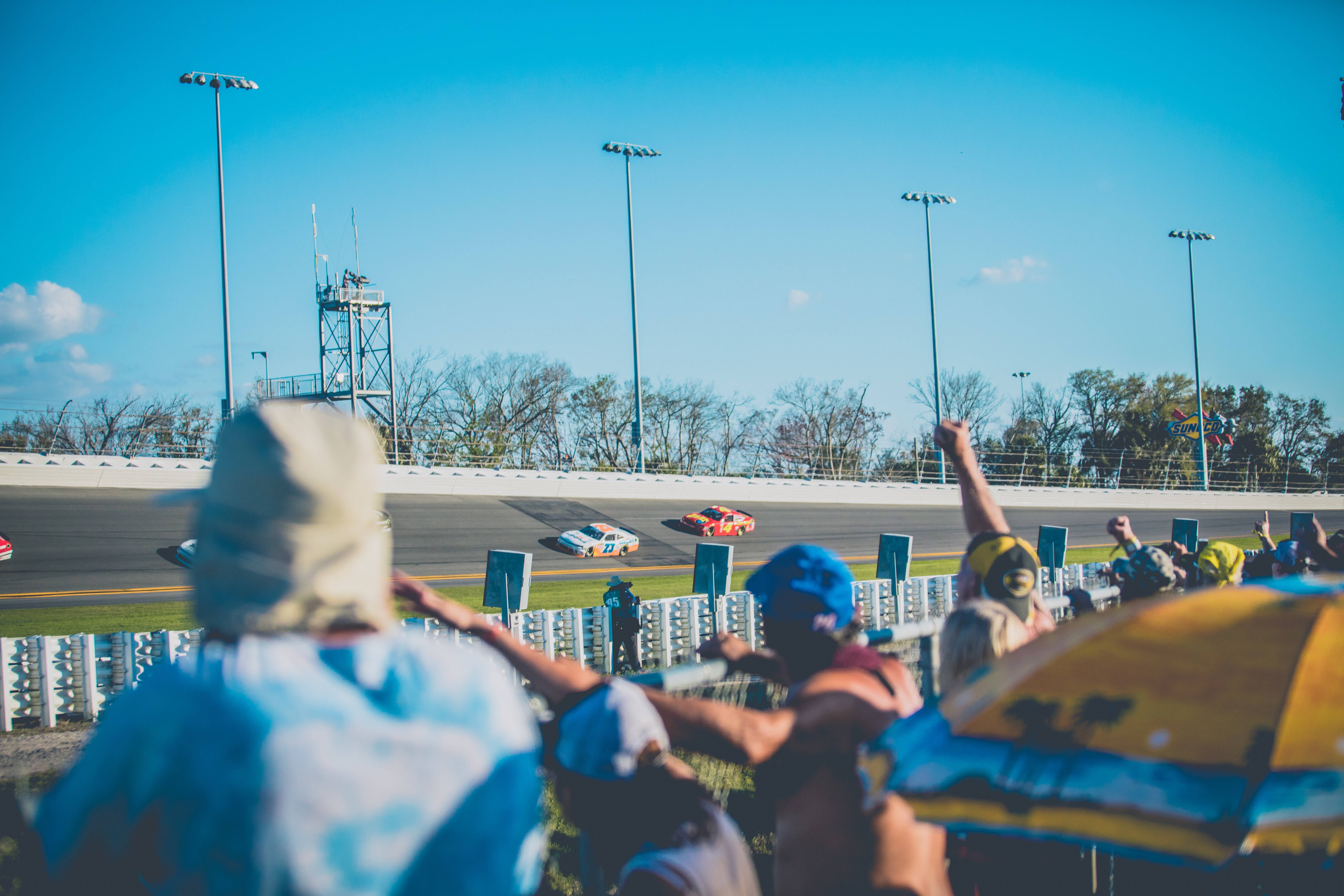 Sports fan cheering at a racetrack