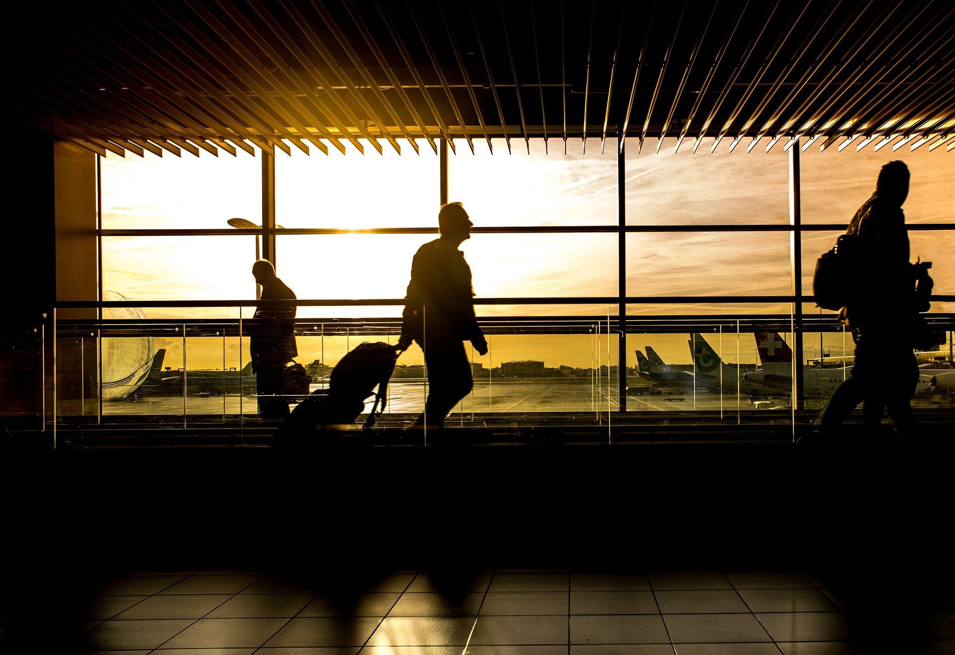 Business travelers walking through an airport | Global agency, BCD Meetings & Events