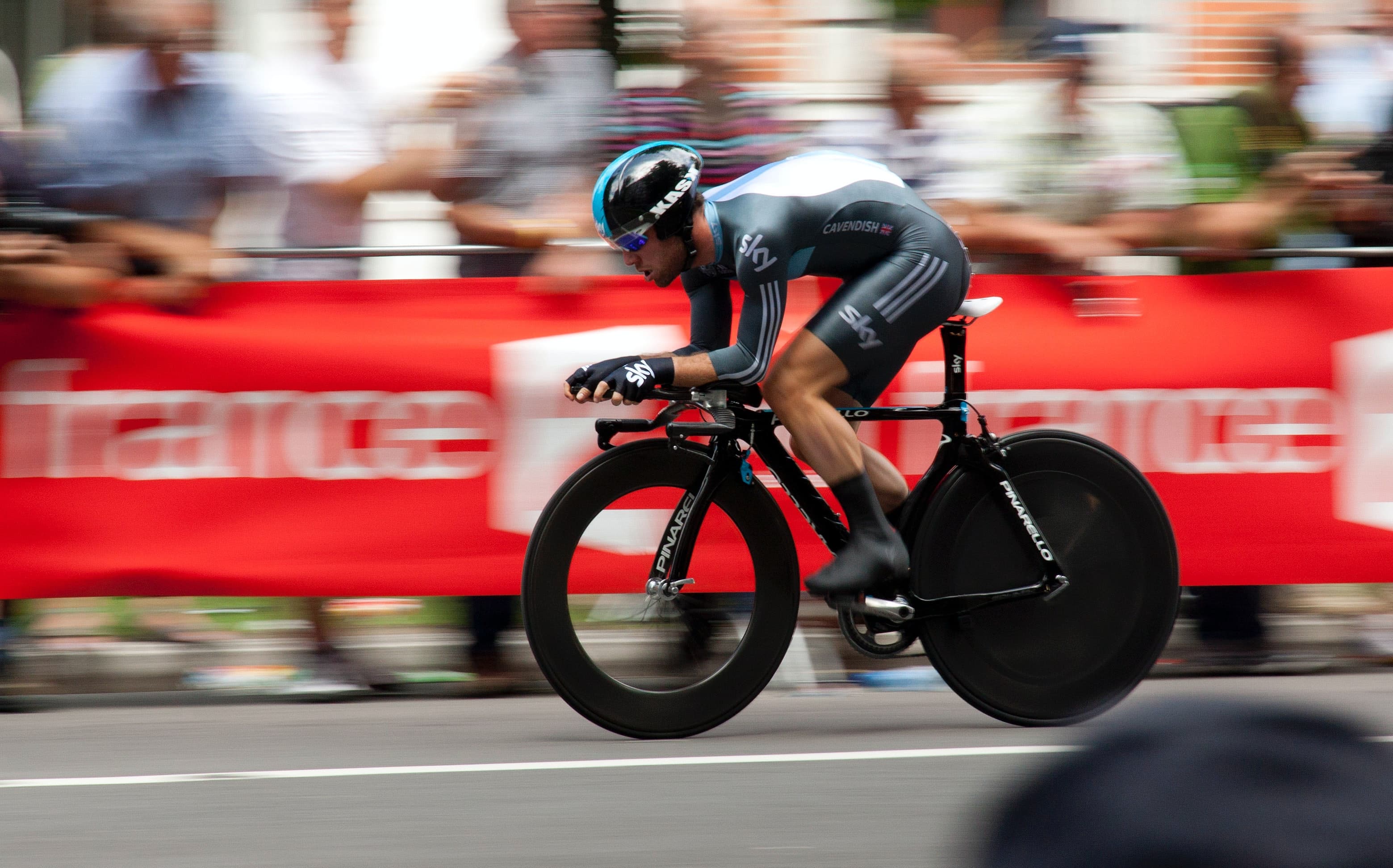 Male professional cyclist taking part in a cycling race for team Sky | Global Agency. BCD Meetings & Events