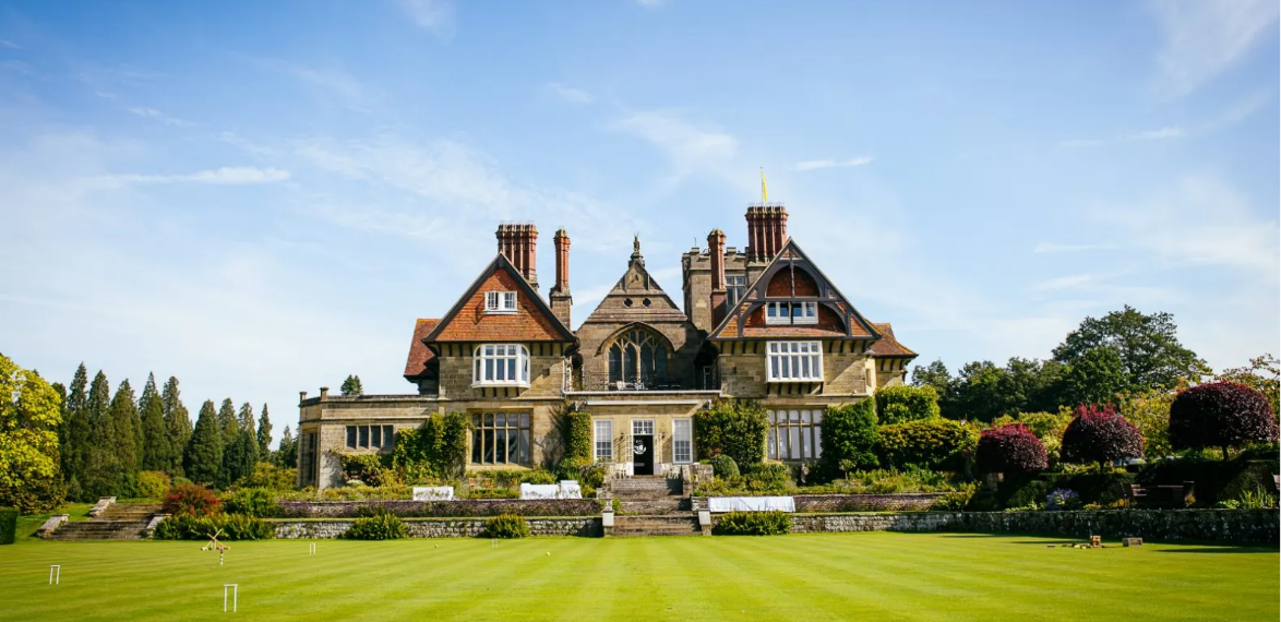 A large house with large lawn in front