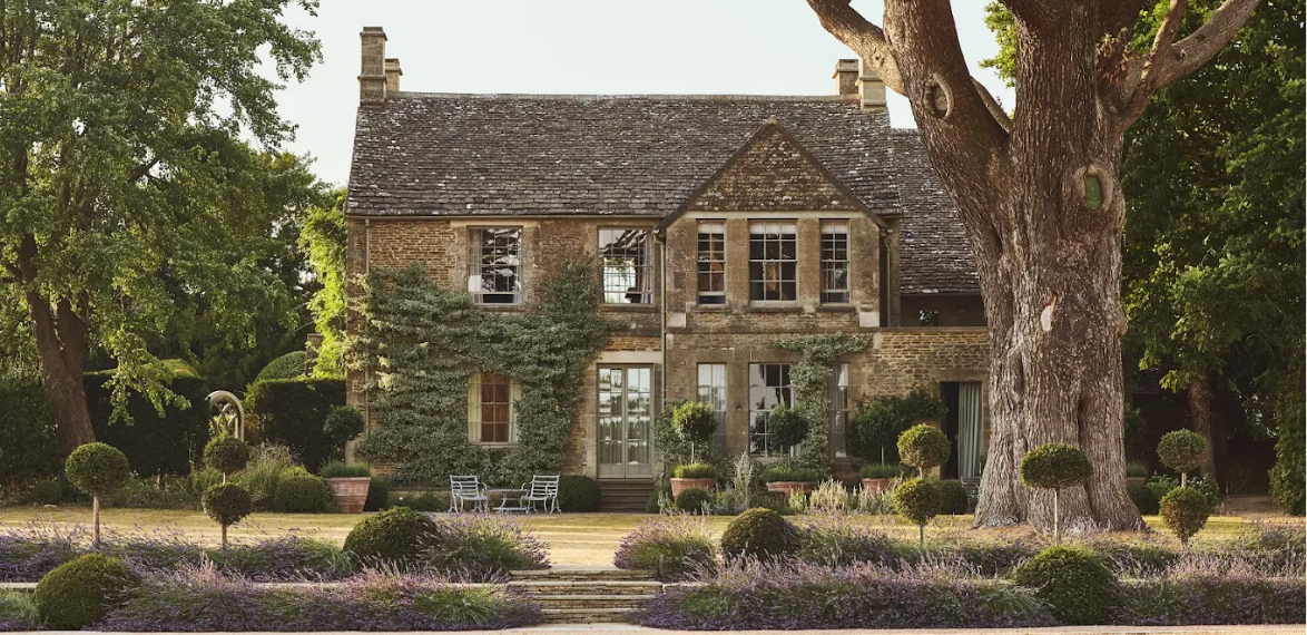Cotswold house with a garden and lawn in front