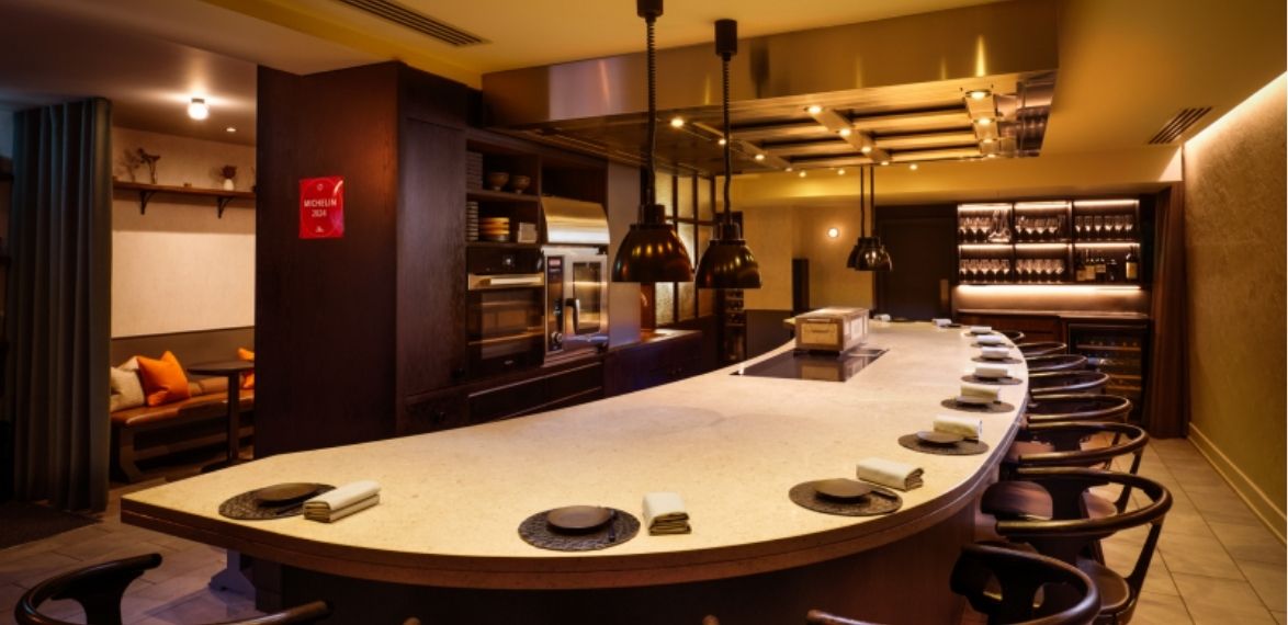 Curved dining space looking at chefs