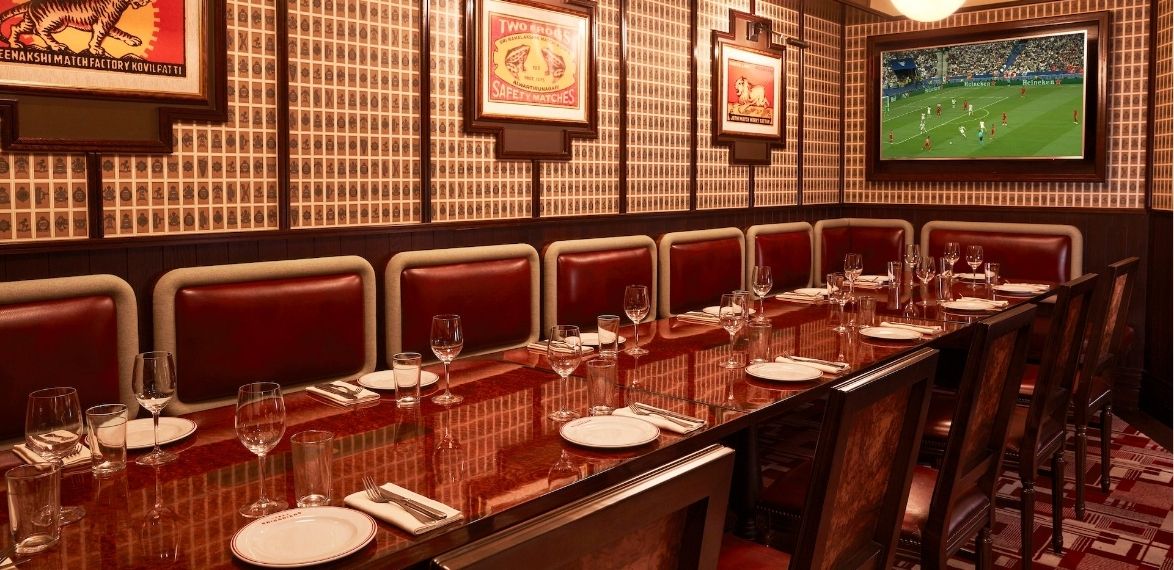 Table laid with wallpaper and art in the background