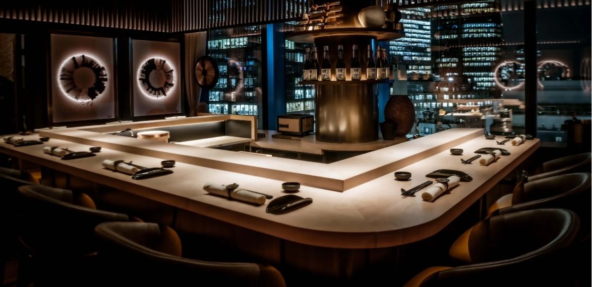Darkly lit chefs table