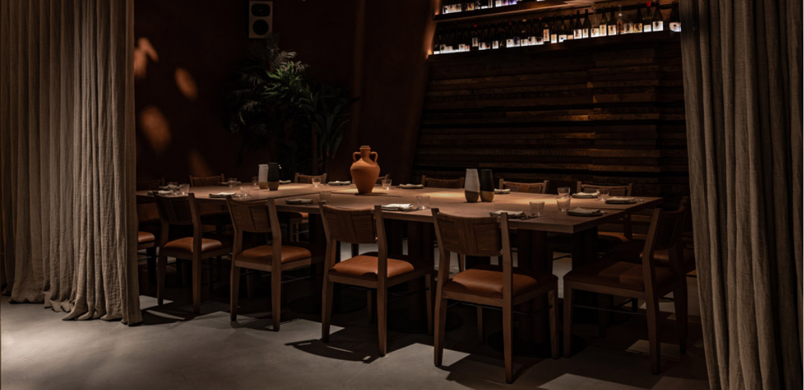 Darkly lit table with chairs