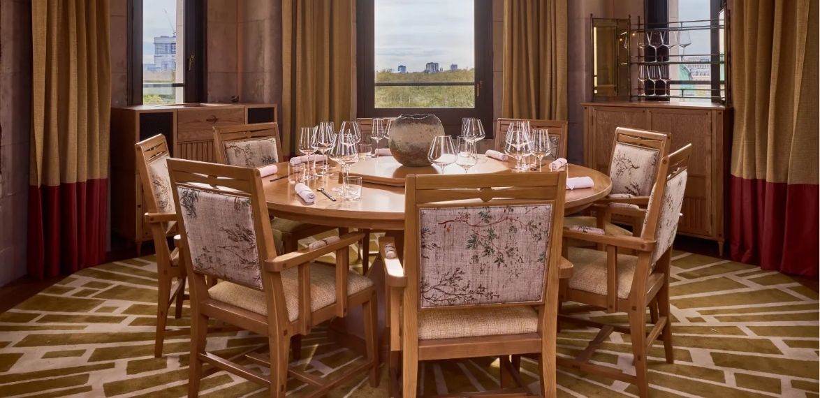 A set up table in a circular room with views